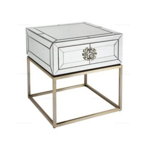 Mirrored side table with geometric design and metal legs.