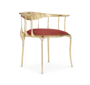 Gold chair with red cushion, elegant design.