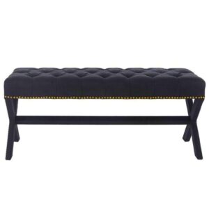Black tufted bench with gold stud accents.