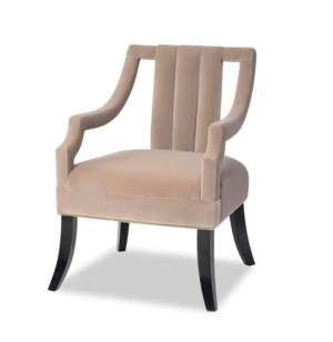 Beige velvet armchair with dark wooden legs.