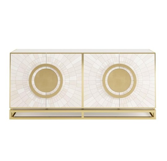 Modern gold and white cabinet with geometric design.