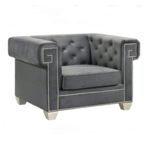 Luxury grey velvet armchair, tufted design, studded accents.
