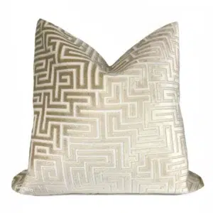 Beige cushion with geometric maze pattern.