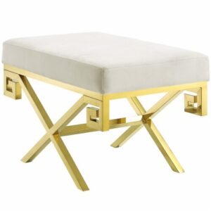 White cushioned stool with gold geometric legs.