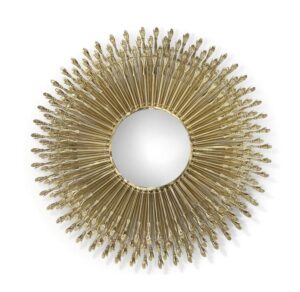 Gold sunburst mirror with intricate design.