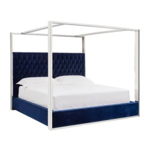 Luxurious blue velvet canopy bed with white bedding.