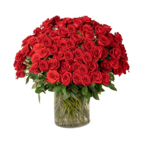 Large bouquet of red roses in glass vase.