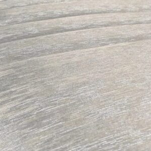 Close-up of textured beige fabric with subtle sheen.