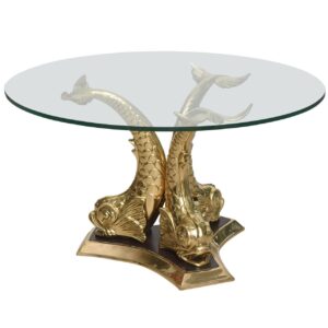Round glass table with gold fish-shaped base.