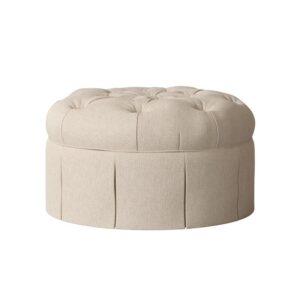 Round beige ottoman with tufted top