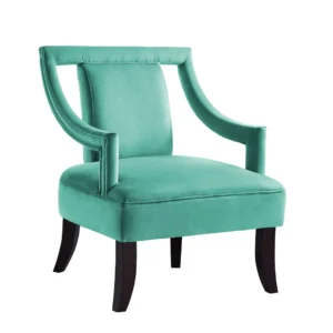 Turquoise velvet armchair with dark wooden legs.