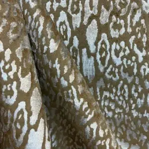 Brown leopard print fabric texture close-up.