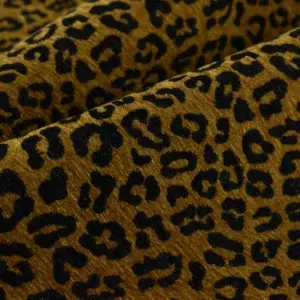 Brown and black leopard print fabric texture.