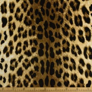 Leopard print fabric close-up with ruler scale.