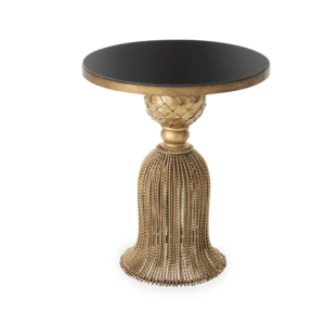 Elegant gold pedestal table with black top.
