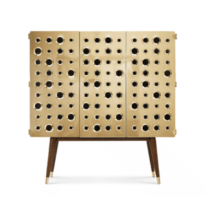 Gold cabinet with circular patterns and wooden legs.