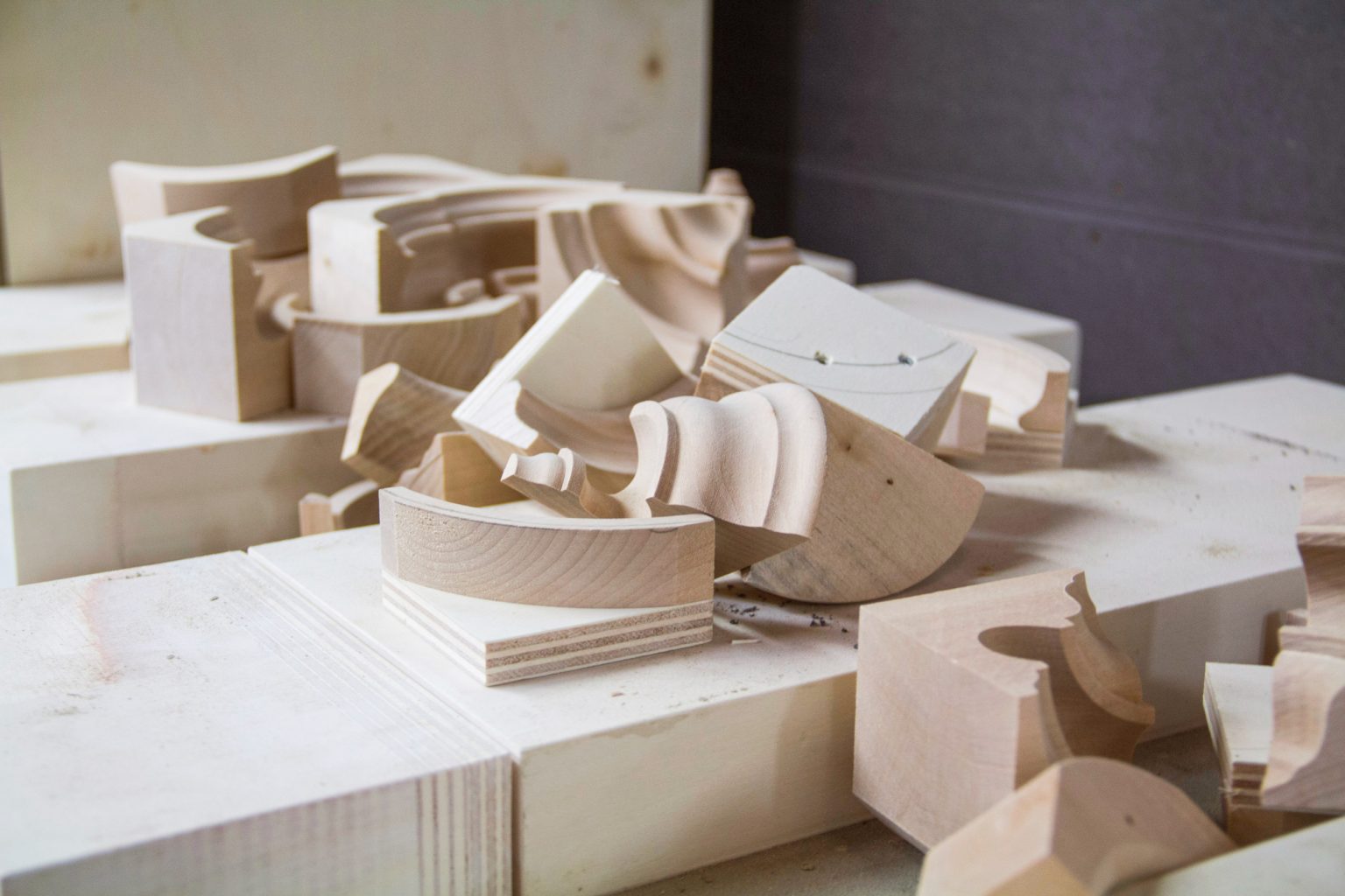 Wood carving blocks on a workbench.