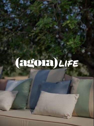 Outdoor sofa with Agora Life cushions under tree.