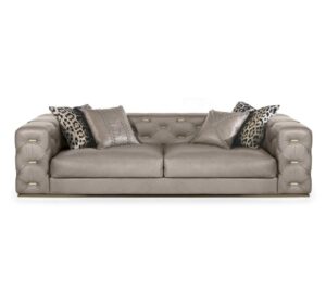 Luxurious beige sofa with decorative cushions.