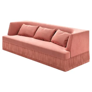 Pink velvet sofa with fringe and cushions.